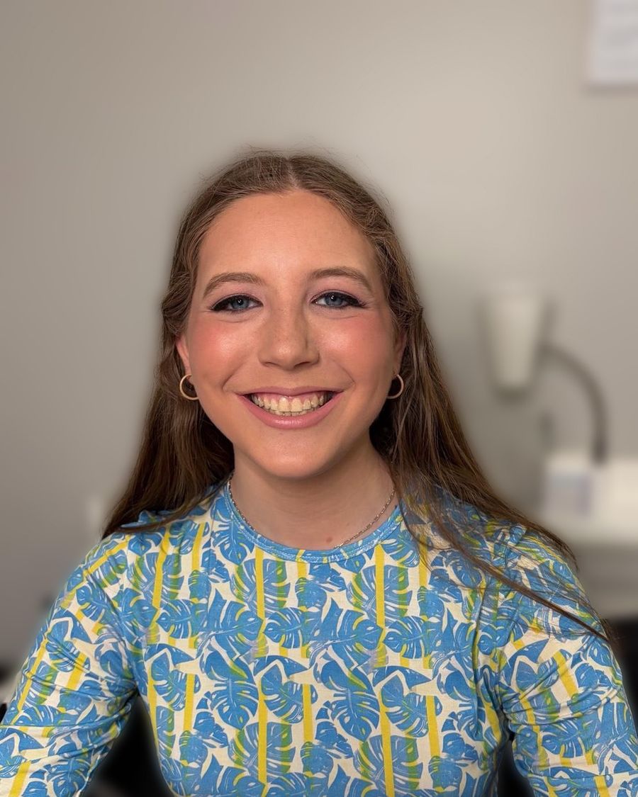 Bright daytime makeup, hair worn long