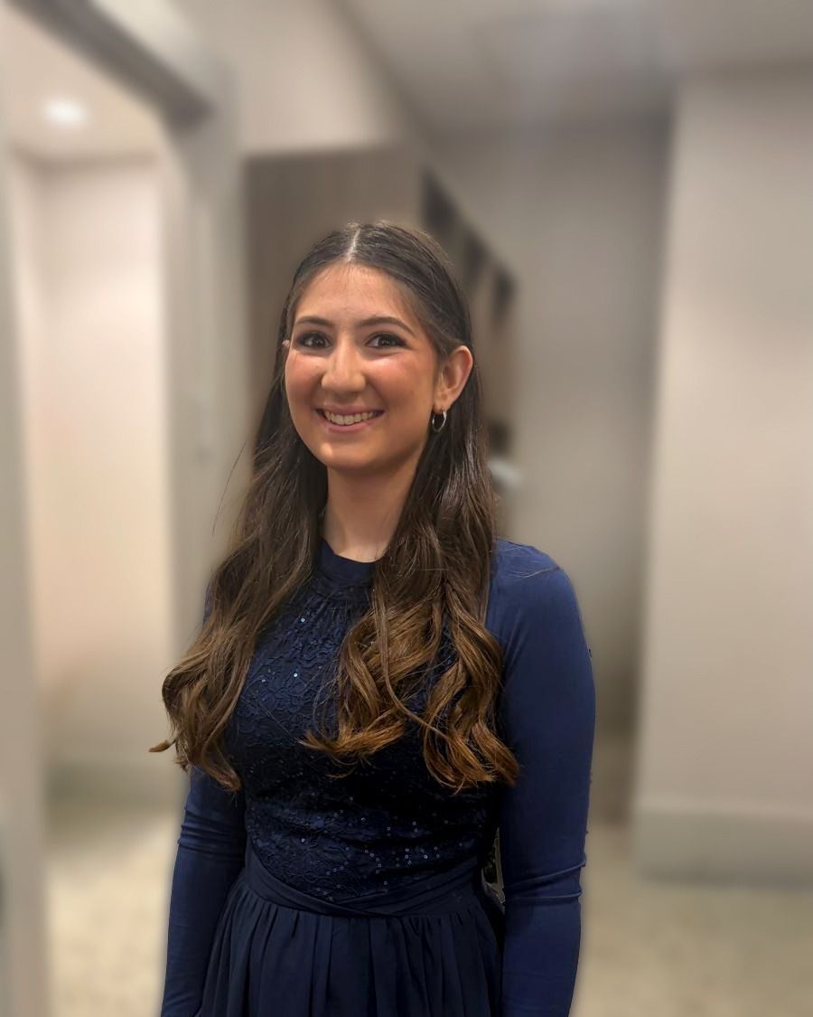 Occasion makeup with a navy gown, hair half up