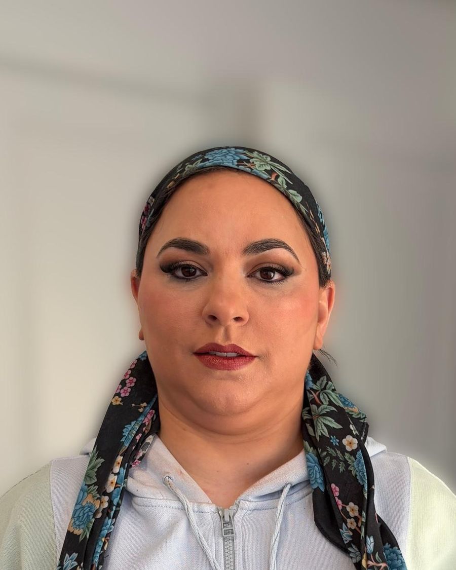 Defined evening makeup worn with a patterned tichel